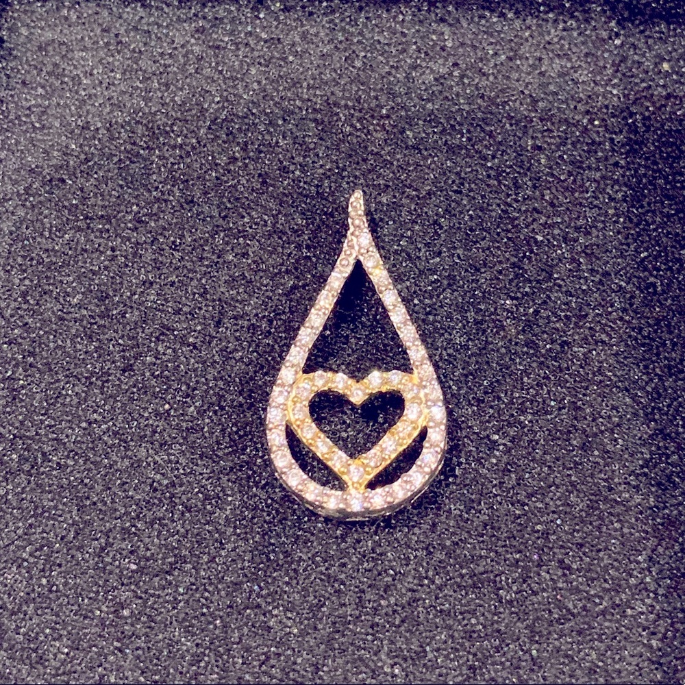 Teardrop with heart silver pendant.